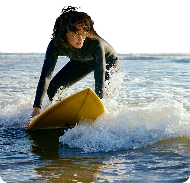 A woman surfing.